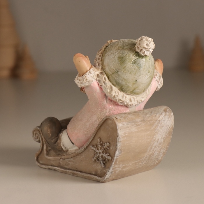 Сувенир полистоун "Малышка в санках, летит с горки" розовый 9х7,8х9 см