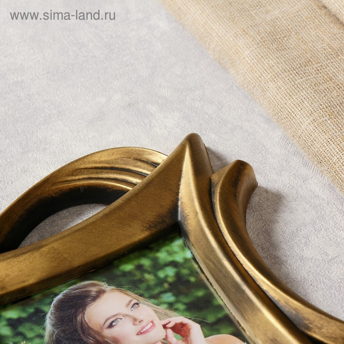 Фоторамка пластик на 3 фото 10х15 см Фоторамка пластик на 3 фото 10х15 см "Плавные линии" т.золото 25х55,5 см