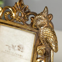 Фоторамка полистоун 10х15 см "Попугаи" состаренное золото 26,5х20,5 см Фоторамка полистоун 10х15 см "Попугаи" состаренное золото 26,5х20,5 см