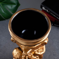 Фигурное кашпо "Два мальчика с чашей", бронза 0,6л/ 15х17х37см Фигурное кашпо "Два мальчика с чашей", бронза 0,6л/ 15х17х37см