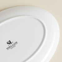 Тарелка для подачи SL Home «Каскарон», 25,4×18,5×2,5 см, овальная, костяной фарфор, белая Тарелка для подачи SL Home «Каскарон», 25,4×18,5×2,5 см, овальная, костяной фарфор, белая