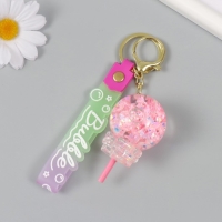 Брелок пластик с карабином, ремешком "Леденец с бантиком" водный с глиттером 4х4х6,5 см Брелок пластик с карабином, ремешком "Леденец с бантиком" водный с глиттером 4х4х6,5 см