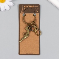 Брелок металл с карабином "Револьвер и череп" бронза 7,5 см Брелок металл с карабином "Револьвер и череп" бронза 7,5 см