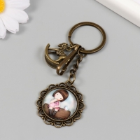 Брелок металл, стекло с карабином "Лошадка-качалка и малышка в медальоне" бронза 9,5 см Брелок металл, стекло с карабином "Лошадка-качалка и малышка в медальоне" бронза 9,5 см