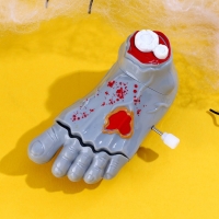 Игрушка заводная "Нога"