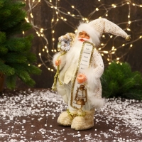Дед Мороз "С бантиками на ботиночках и с фонариком" 30 см, золотисто-белый Дед Мороз "С бантиками на ботиночках и с фонариком" 30 см, золотисто-белый