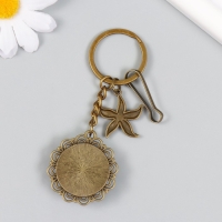 Брелок металл, стекло с карабином "Морская звезда и рыбки в медальоне" бронза 9,5 см Брелок металл, стекло с карабином "Морская звезда и рыбки в медальоне" бронза 9,5 см