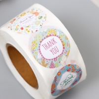 Наклейка бумага "Благодарим" d=2,5 см 500 шт в рулоне 3х6х6см Наклейка бумага "Благодарим" d=2,5 см 500 шт в рулоне 3х6х6см