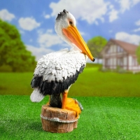 Садовая фигура "Пеликан с рыбкой" 26х17х44см Садовая фигура "Пеликан с рыбкой" 26х17х44см