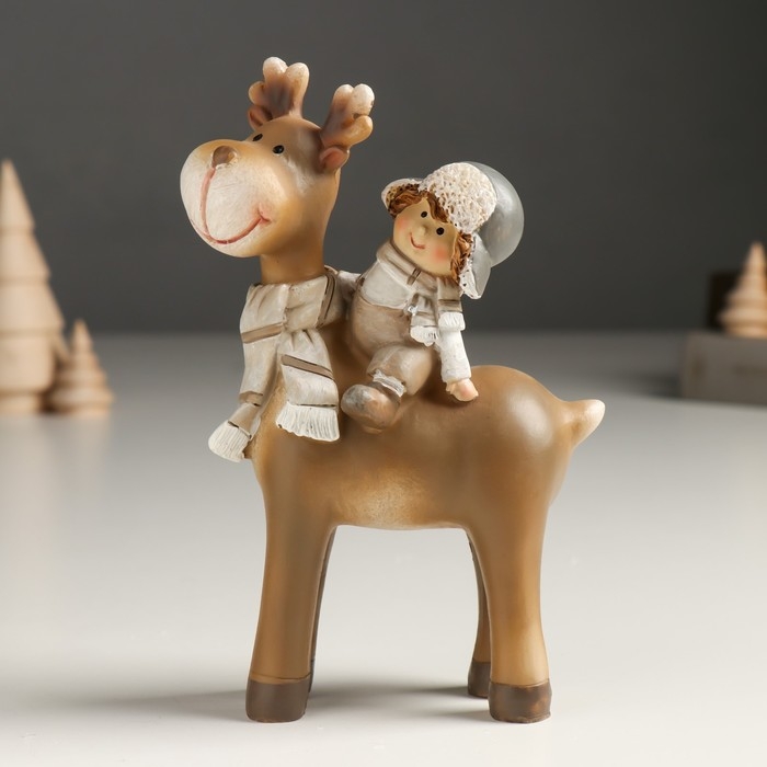 Сувенир полистоун "Малыш в шапке-ушанке верхом на лосике" беж 6х11х14 см